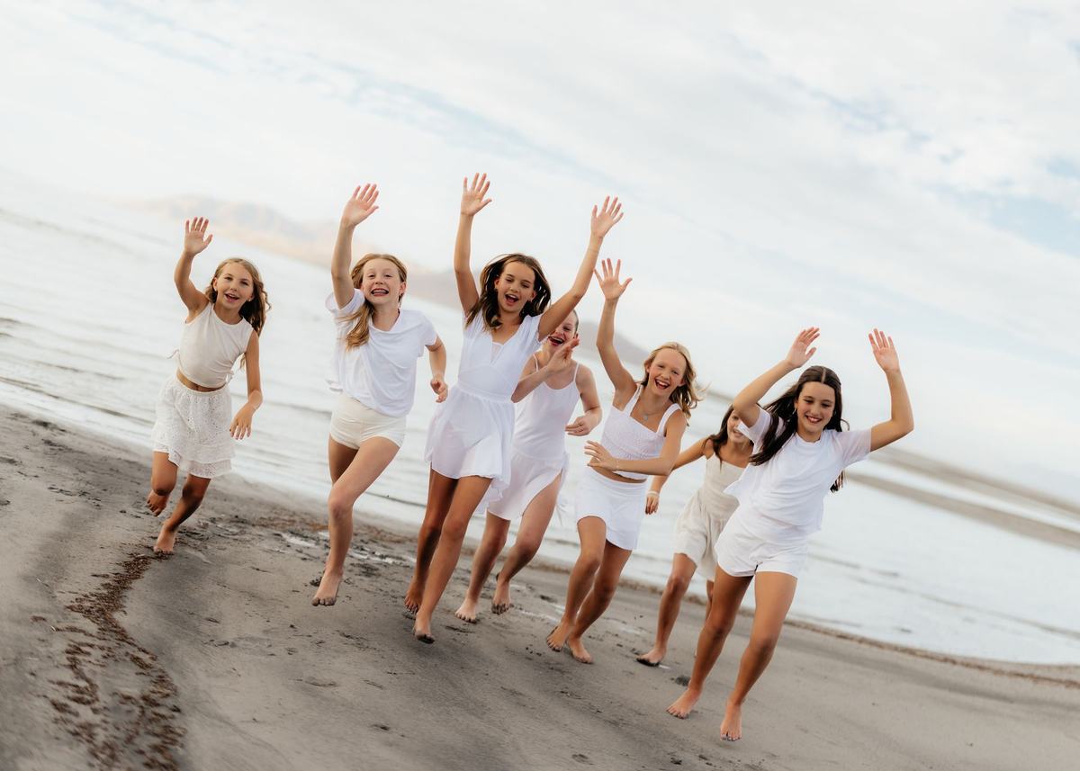 Anchor dancers running and celebrating on the beach
