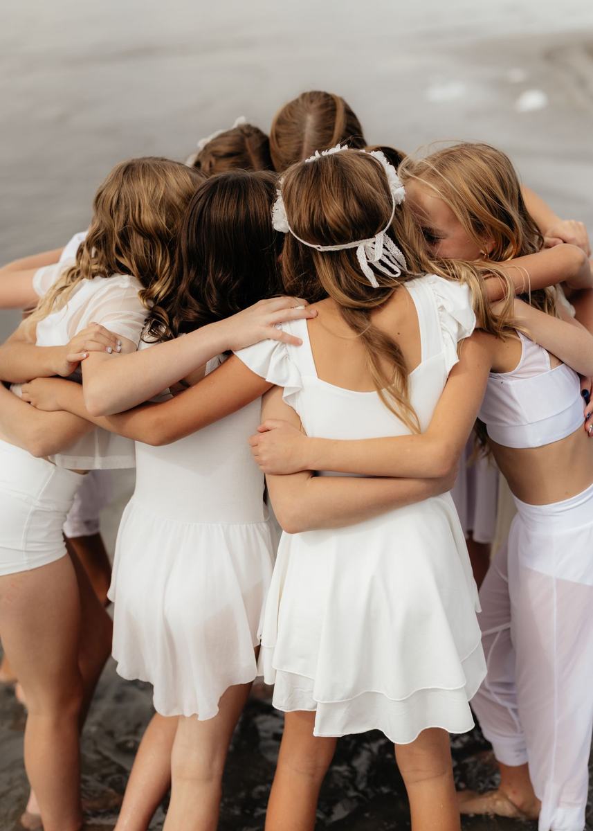 Anchor dancers hugging