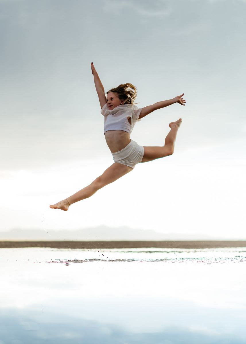 An Anchor dancer mid-leap over the water