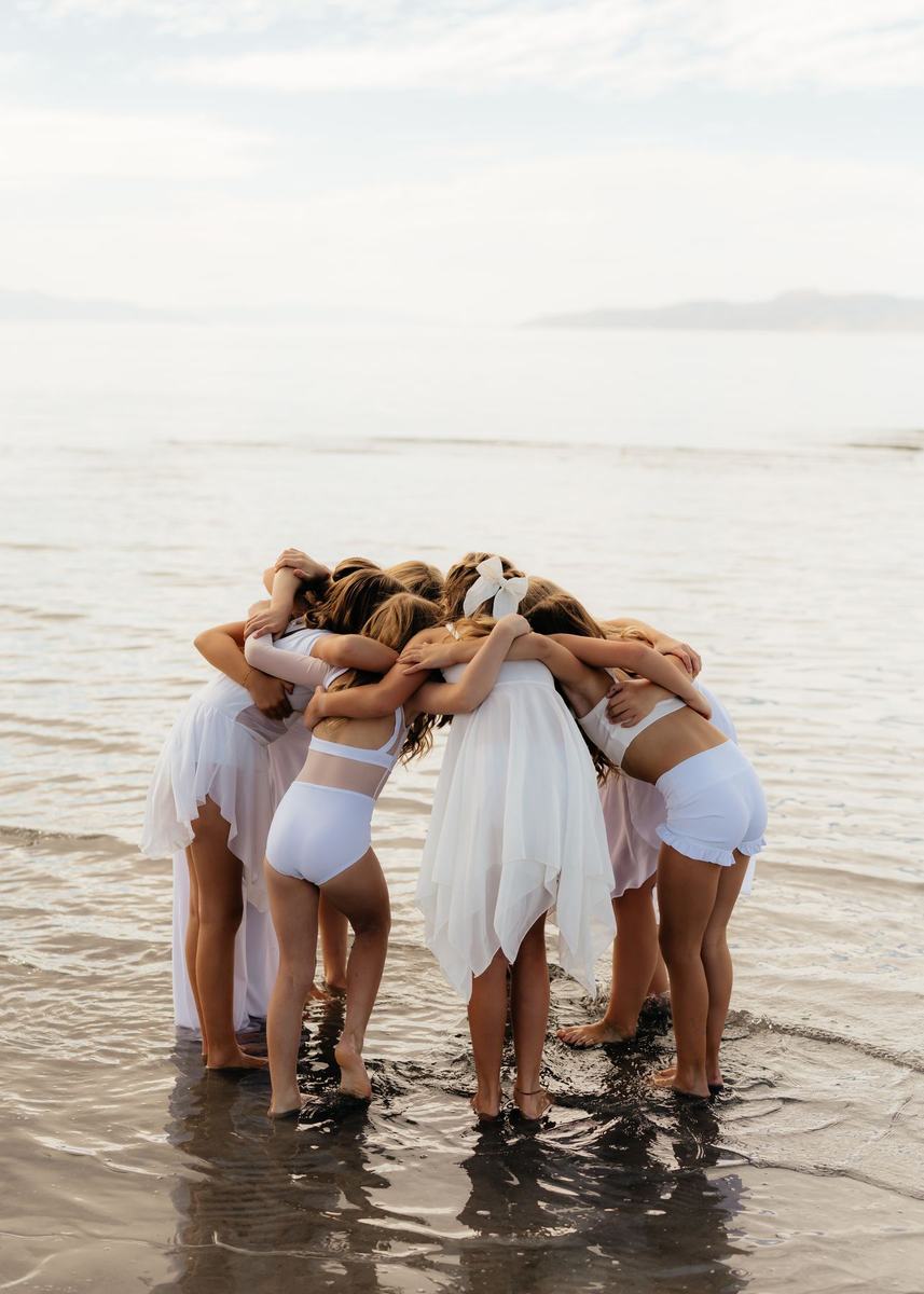 Anchor dancers in a group huddle