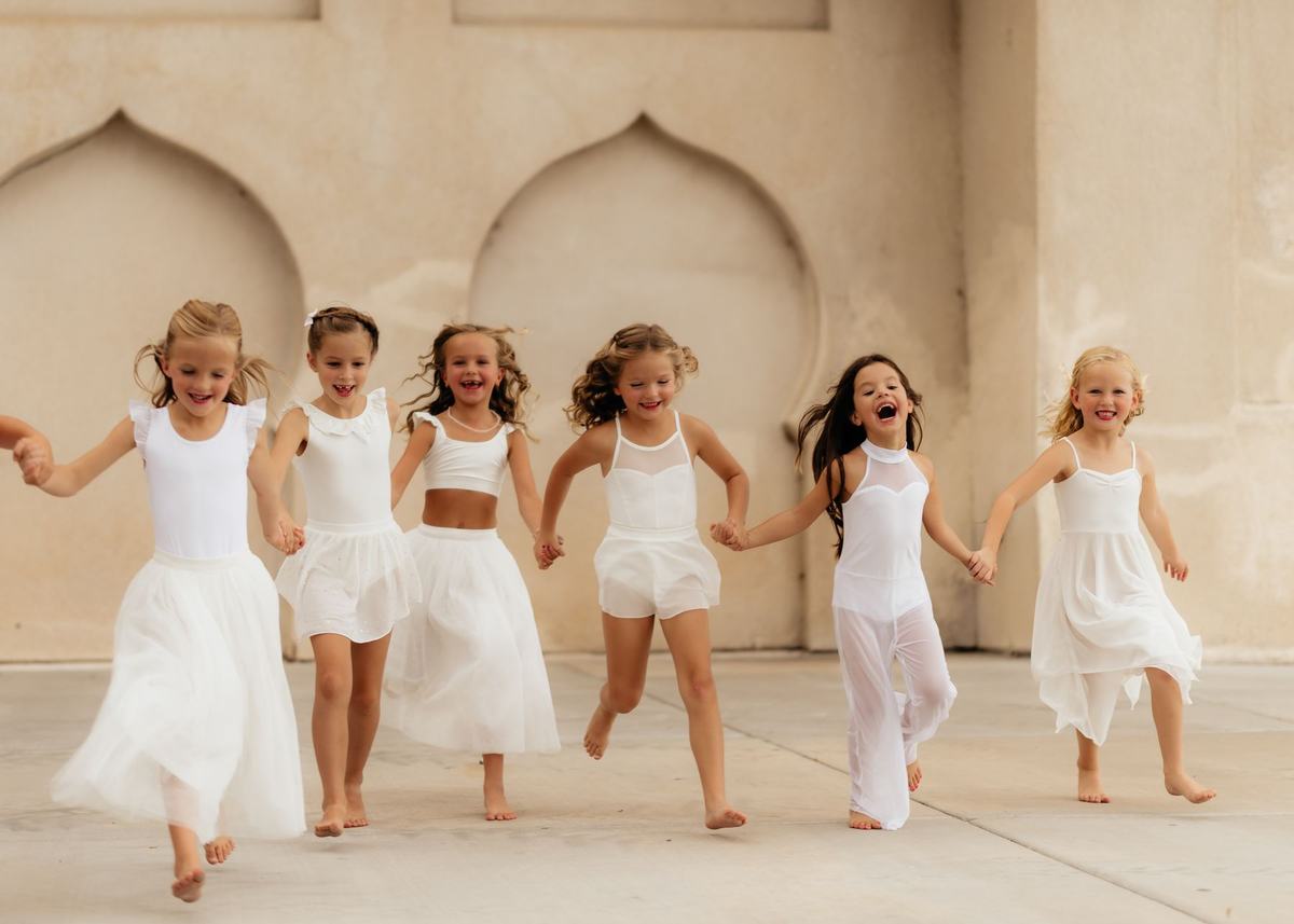 Young Anchor dancers running and laughing